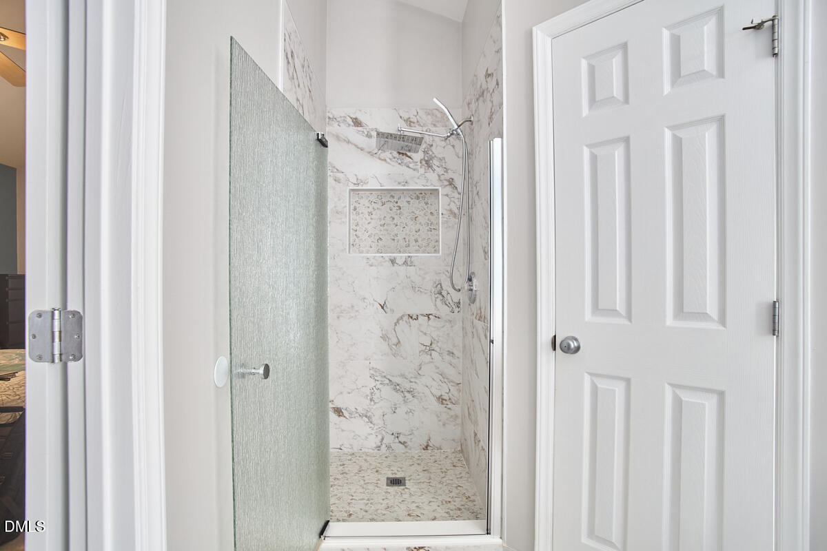 8441 Lunar Stone Place Raleigh, NC 27613 - Photo 31 of 43 a bathroom with a shower