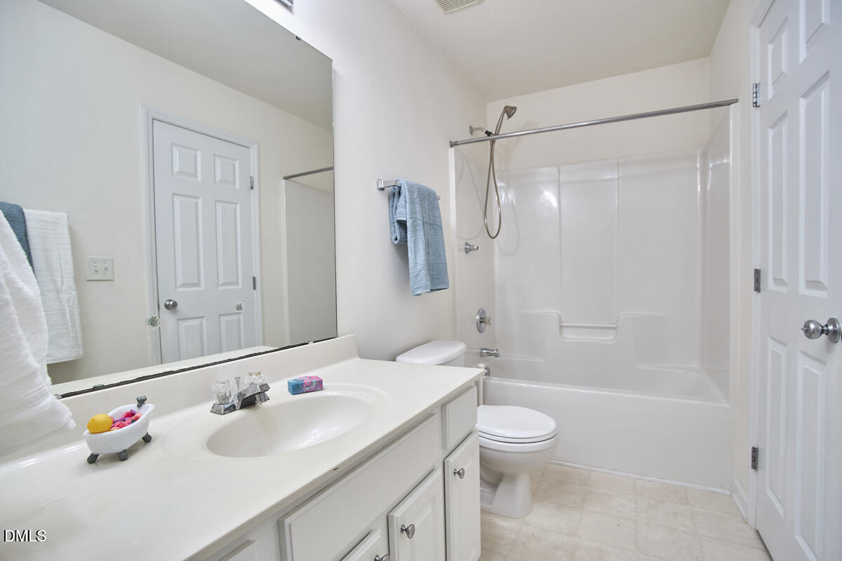 8441 Lunar Stone Place Raleigh, NC 27613 - Photo 34 of 43 a bathroom with a sink vanity granite tub and shower