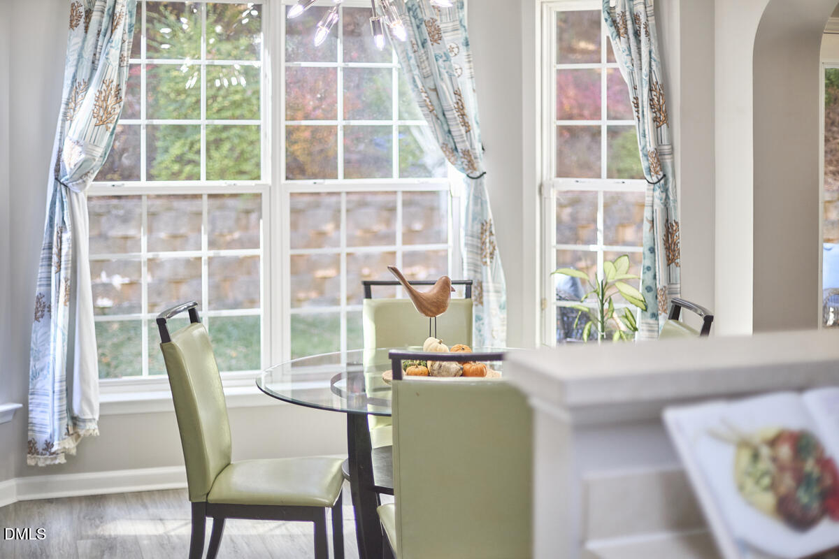 8441 Lunar Stone Place Raleigh, NC 27613 - Photo 36 of 43 a dining room with furniture and window