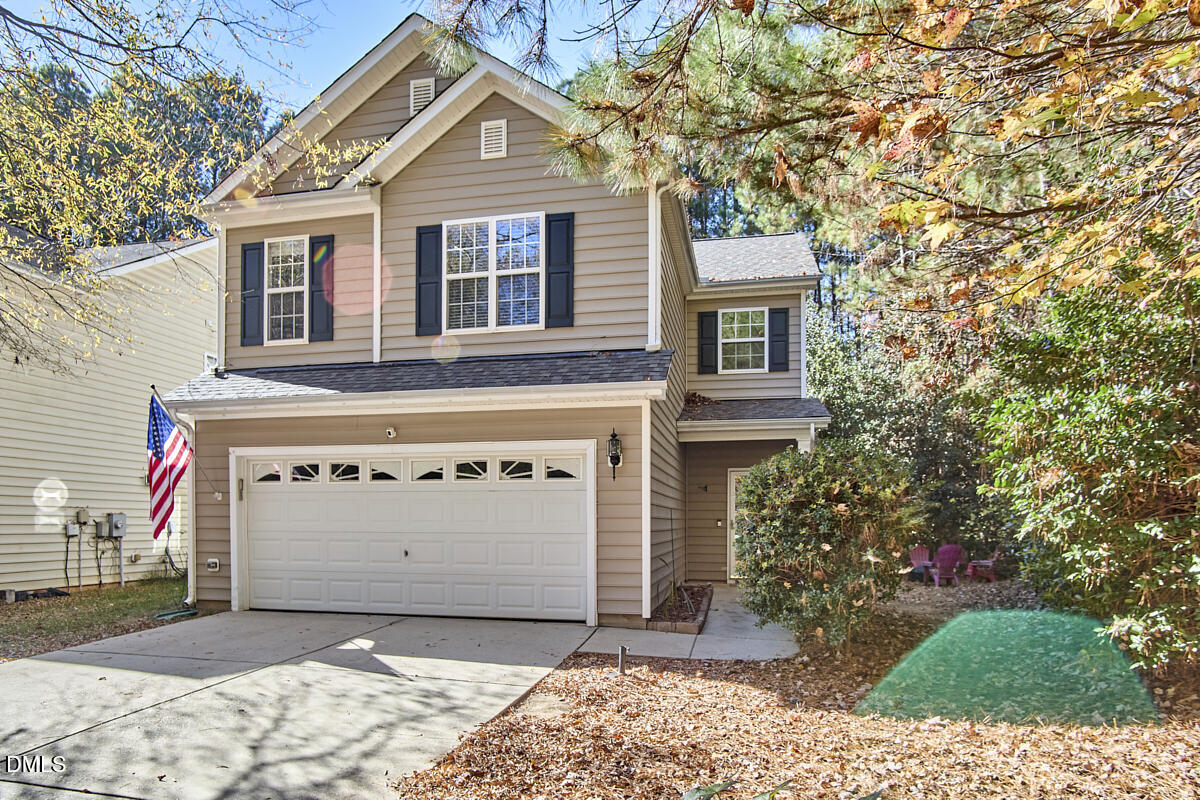 8441 Lunar Stone Place Raleigh, NC 27613 - Photo 4 of 43 a front view of a house with a yard