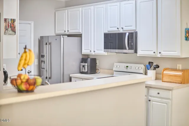 a kitchen with a sink cabinets and a stove
