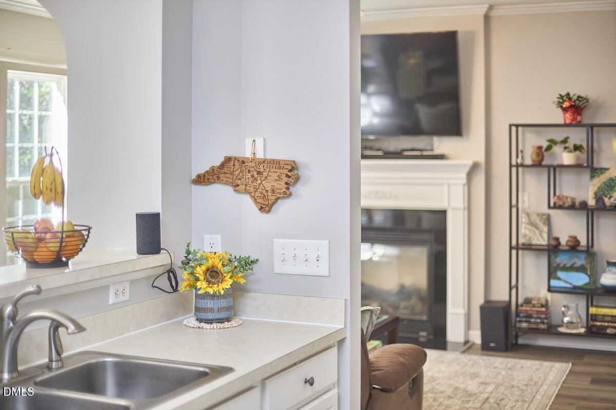 8441 Lunar Stone Place Raleigh, NC 27613 - Photo 43 of 43 a kitchen with a sink cabinets and a stove