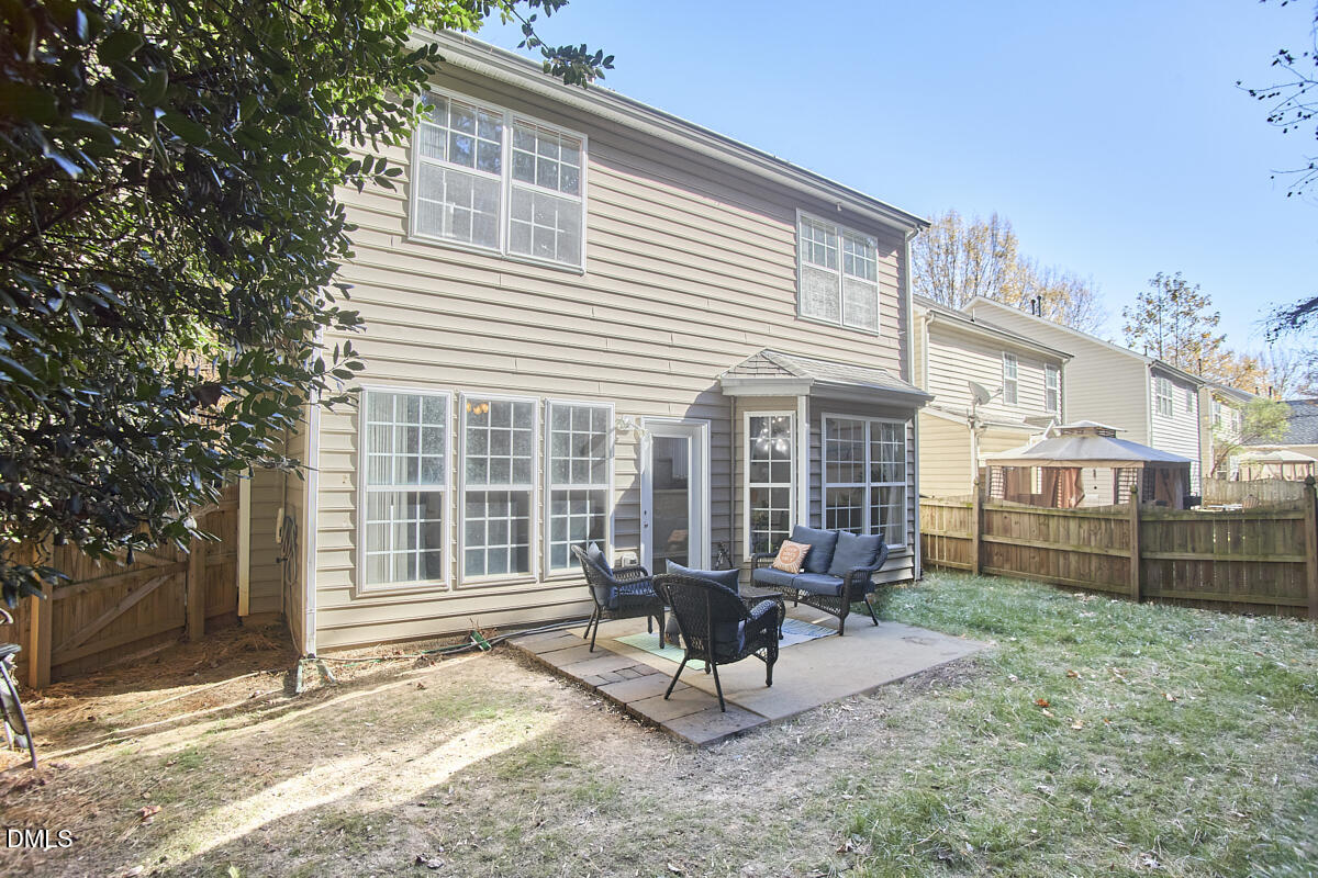 8441 Lunar Stone Place Raleigh, NC 27613 - Photo 8 of 43 a view of a house with backyard wooden and sitting area