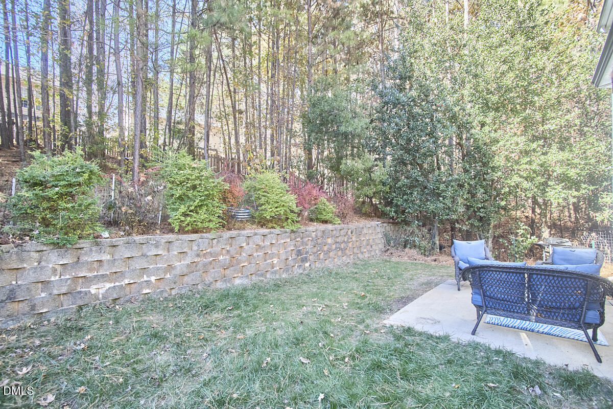 8441 Lunar Stone Place Raleigh, NC 27613 - Photo 9 of 43 a garden view with a seating space