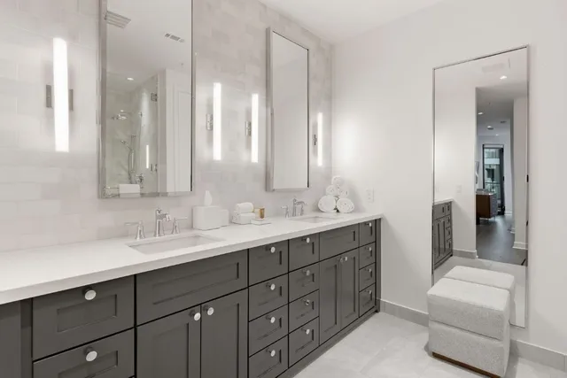 a large bed sitting in a bedroom next to a window