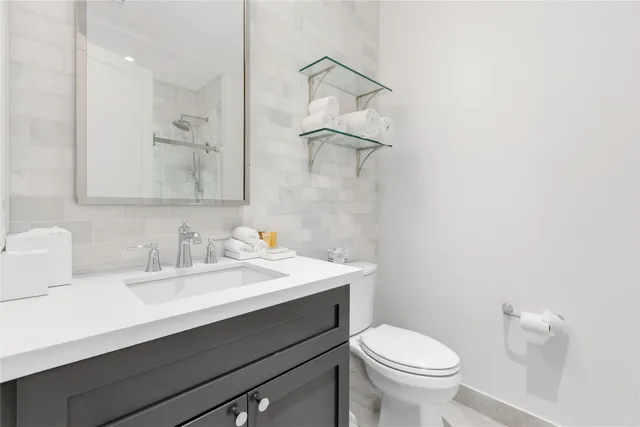 a bedroom with a bed and a table