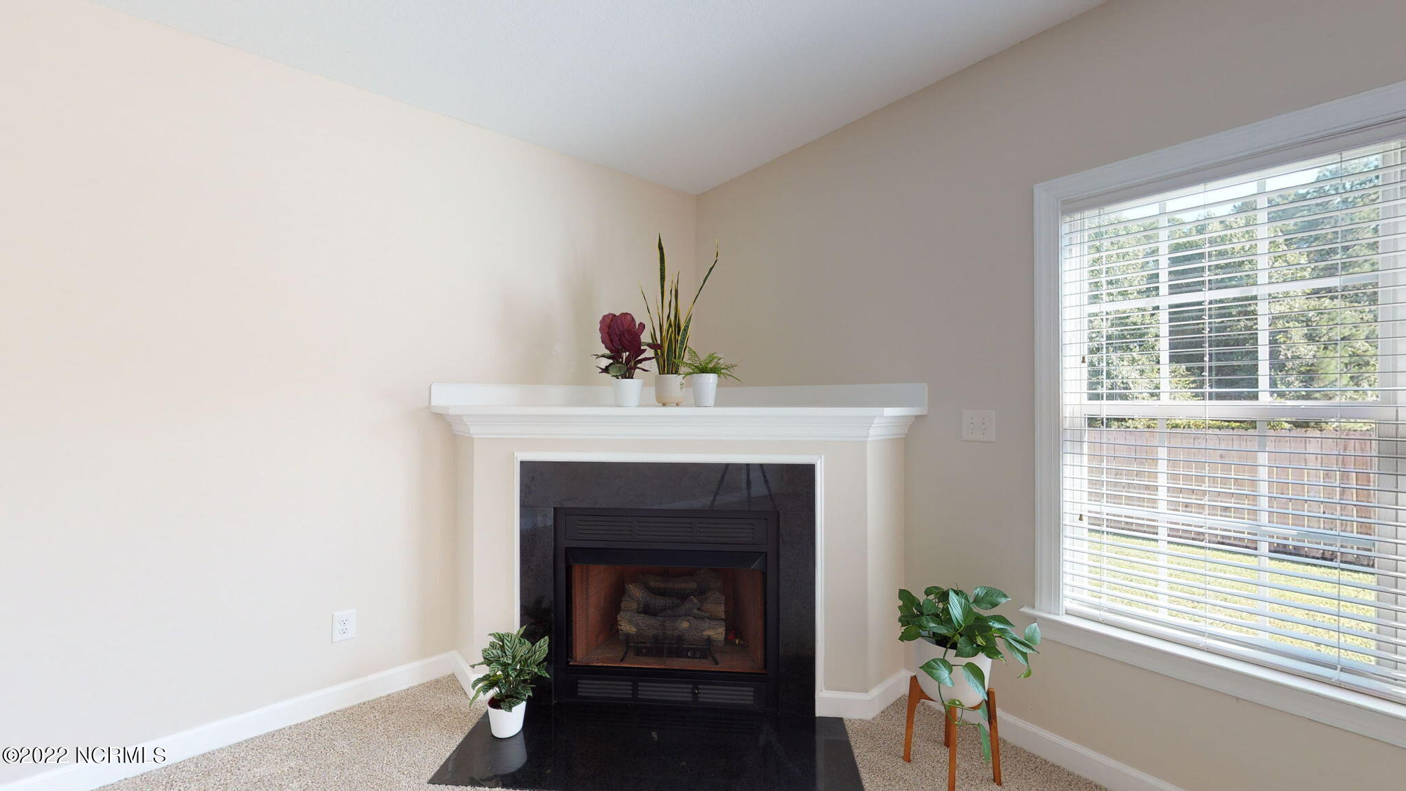 200 Bell Ridge Lane Hubert, NC 28539 - Photo 22 of 59 Gas fireplace like NEW w/ beautiful black granite surround (propane tank can be leased) upper shelf can be used for a TV or whatever you desire.