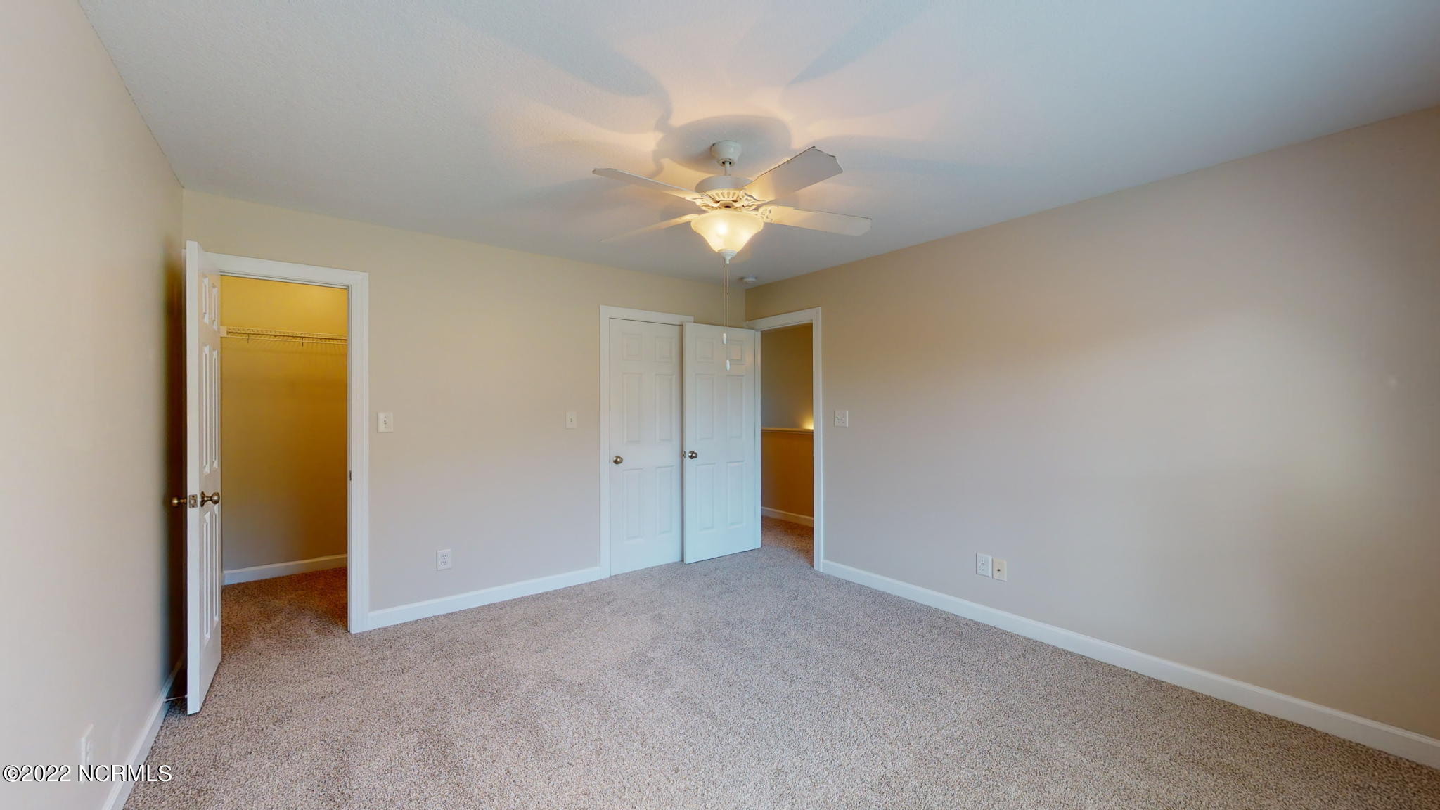 200 Bell Ridge Lane Hubert, NC 28539 - Photo 35 of 59 Large walk-in closet to the left, door to hall bath in the middle. NEW CARPETING!