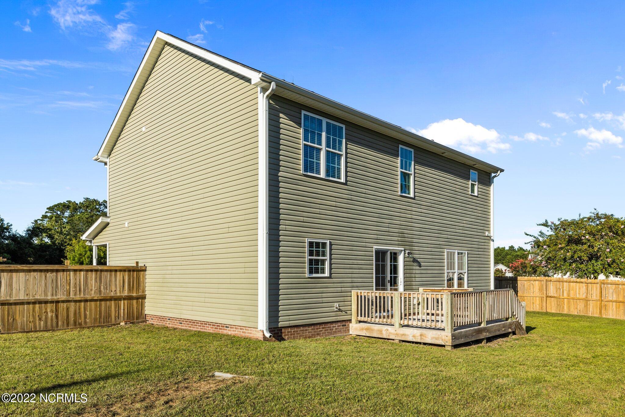 200 Bell Ridge Lane Hubert, NC 28539 - Photo 45 of 59 Gutters, downspouts and Flood Lamps and two exterior water spigots!