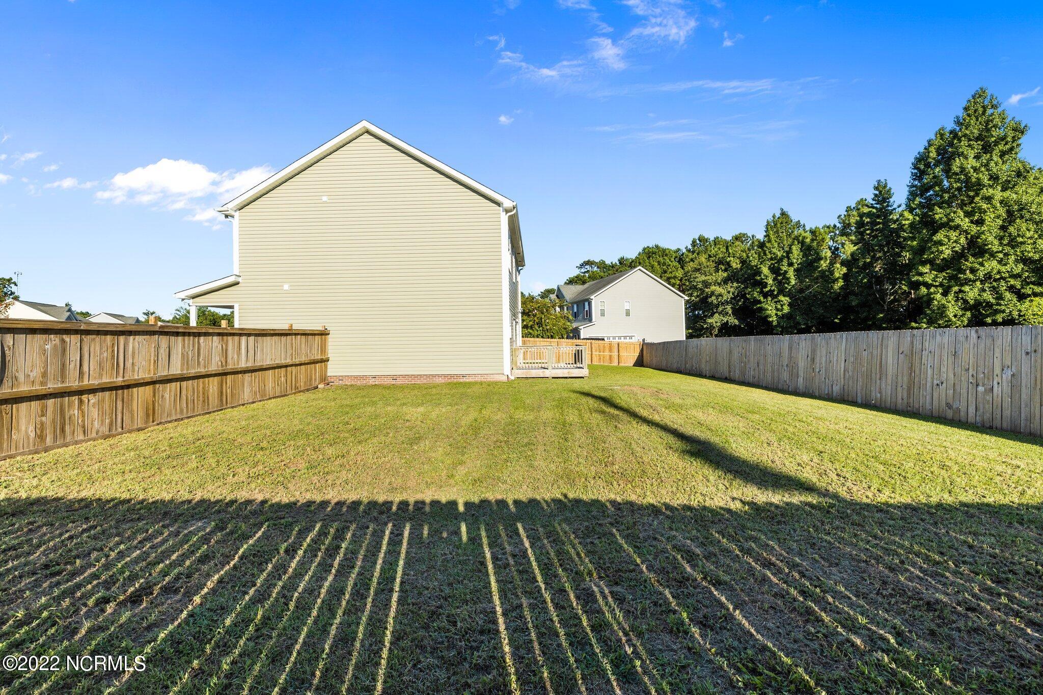 200 Bell Ridge Lane Hubert, NC 28539 - Photo 48 of 59 Plenty of room for all in the fenced back yard, how about a pool?