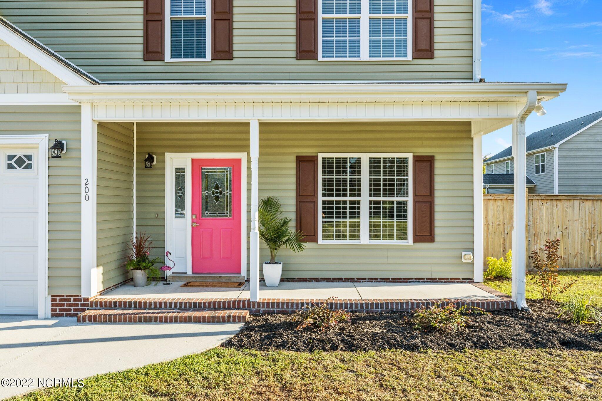 200 Bell Ridge Lane Hubert, NC 28539 - Photo 5 of 59 New door hardware (jewelry) by Baldwin, flower beds have fresh mulch, new shrubs & two new trees tree.