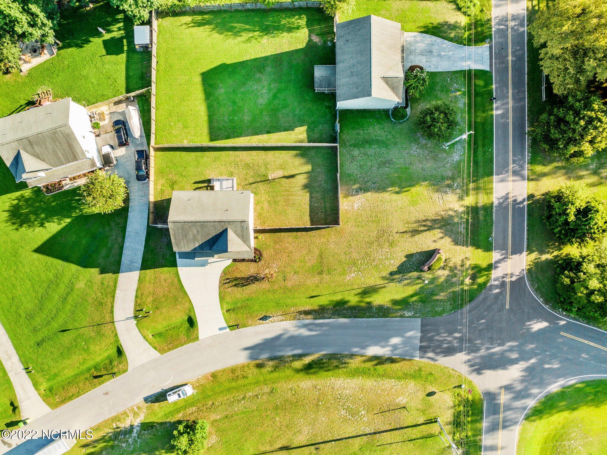 200 Bell Ridge Lane Hubert, NC 28539 - Photo 50 of 59 Large corner lot. The new owner can take the fence to the right and male a larger fenced backyard for an inground pool perhaps.