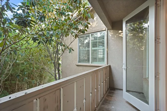 a view of a balcony with an outdoor space