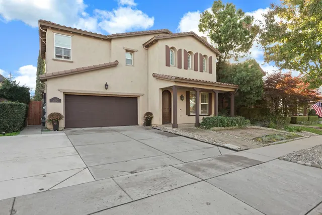 a front view of a house with yard