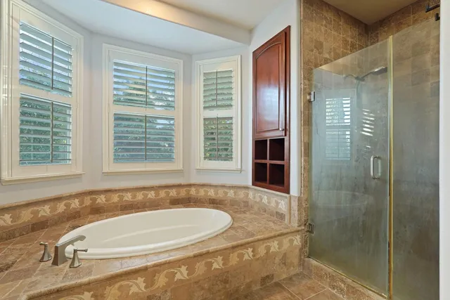 a view of a patio with table and chairs and couches