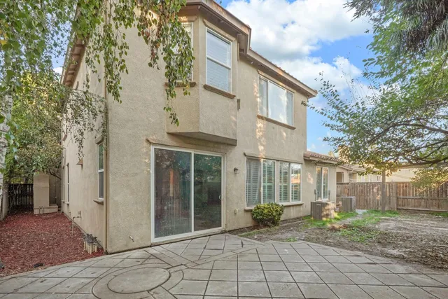 a view of a backyard of the house