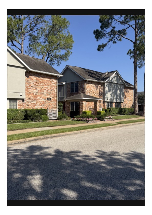 515 Tallowood Road, Unit 55 Houston, TX 77024 - Photo 6 of 18 a view of large house with a big yard