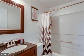 17 Devon Court Sterling, VA 20165 - Photo 17 of 30 a bathroom with a sink and a mirror