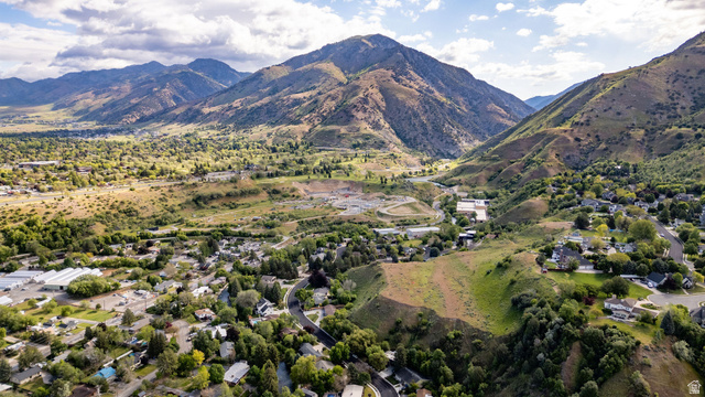 1365 Sumac Drive Logan, UT 84321 - Photo 52 of 66 Mountainous landscape featuring a residential area with varied rooflines and surrounding green spaces