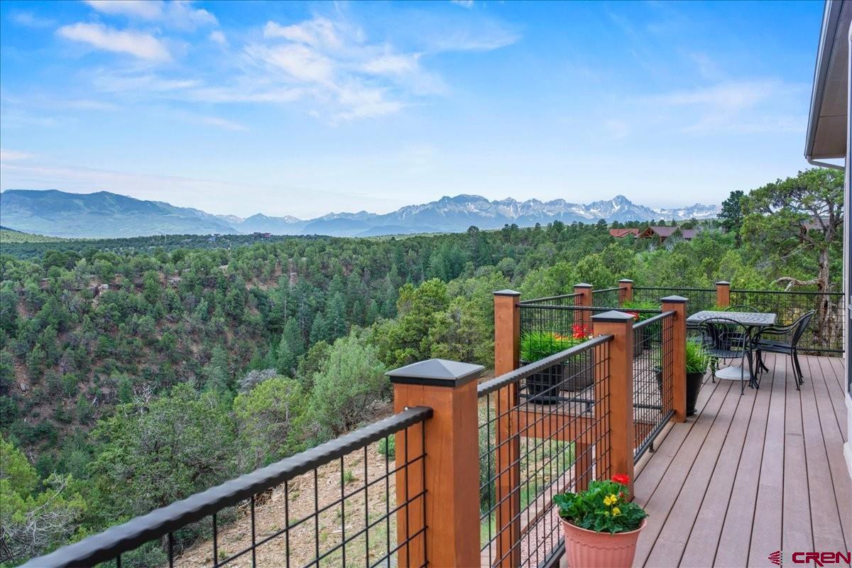 555 Waterview Lane Ridgway, CO 81432 - Photo 21 of 44 a view of a balcony with wooden floor and fence