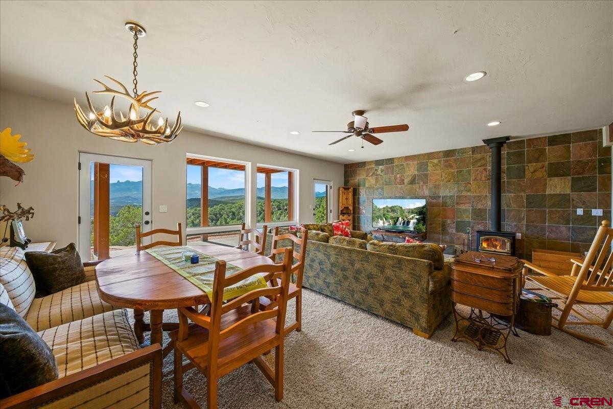 555 Waterview Lane Ridgway, CO 81432 - Photo 26 of 44 a view of a dining room with furniture window and outside view