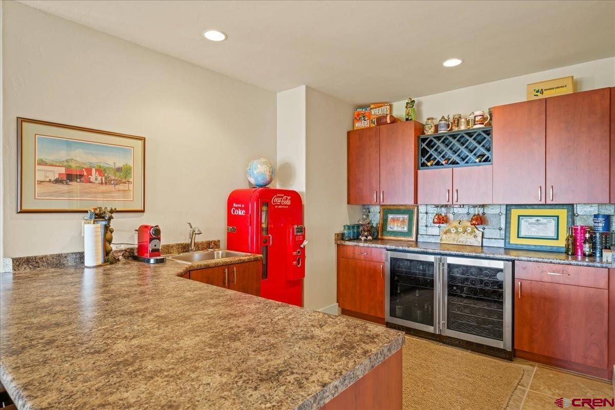 555 Waterview Lane Ridgway, CO 81432 - Photo 29 of 44 a kitchen with stainless steel appliances granite countertop a refrigerator and stove