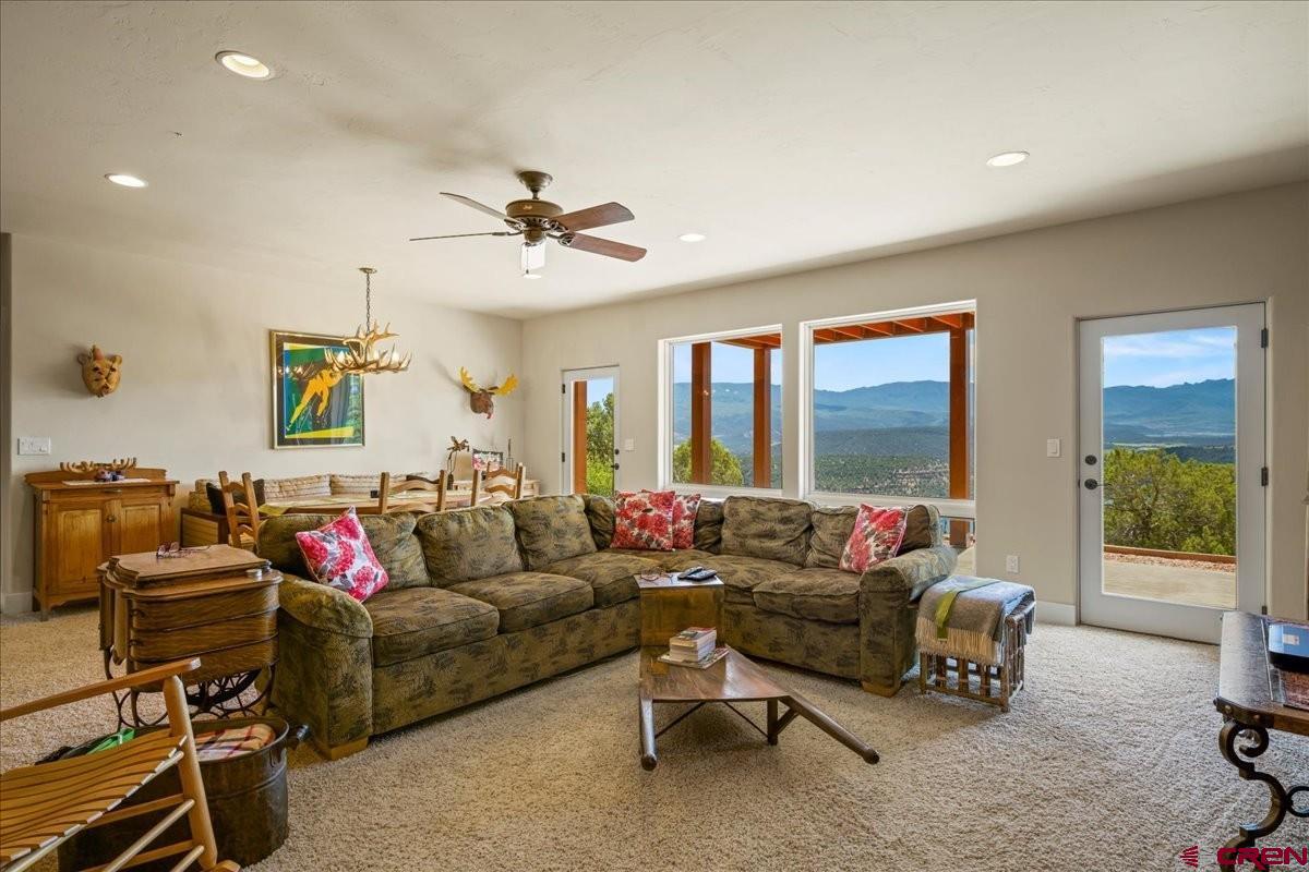 555 Waterview Lane Ridgway, CO 81432 - Photo 32 of 44 a living room with furniture and a large window