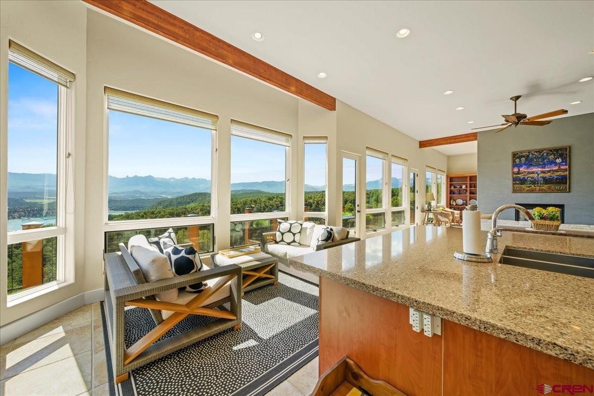 555 Waterview Lane Ridgway, CO 81432 - Photo 10 of 44 a very nice looking living room with a large window and kitchen view