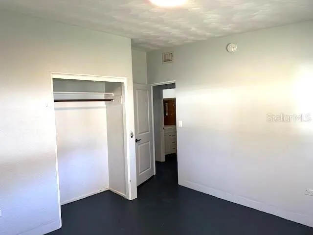 an empty room with wooden floor