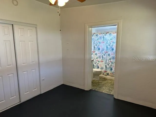 a view of a storage & utility room with closet dryer