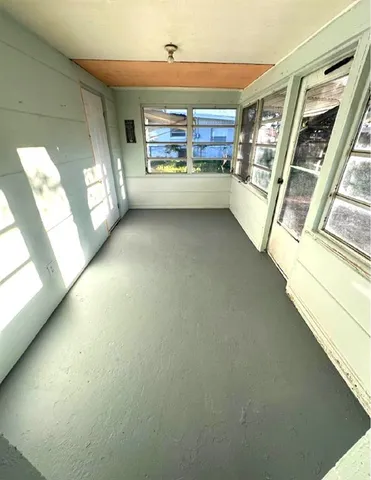 a view of a living room with a fireplace