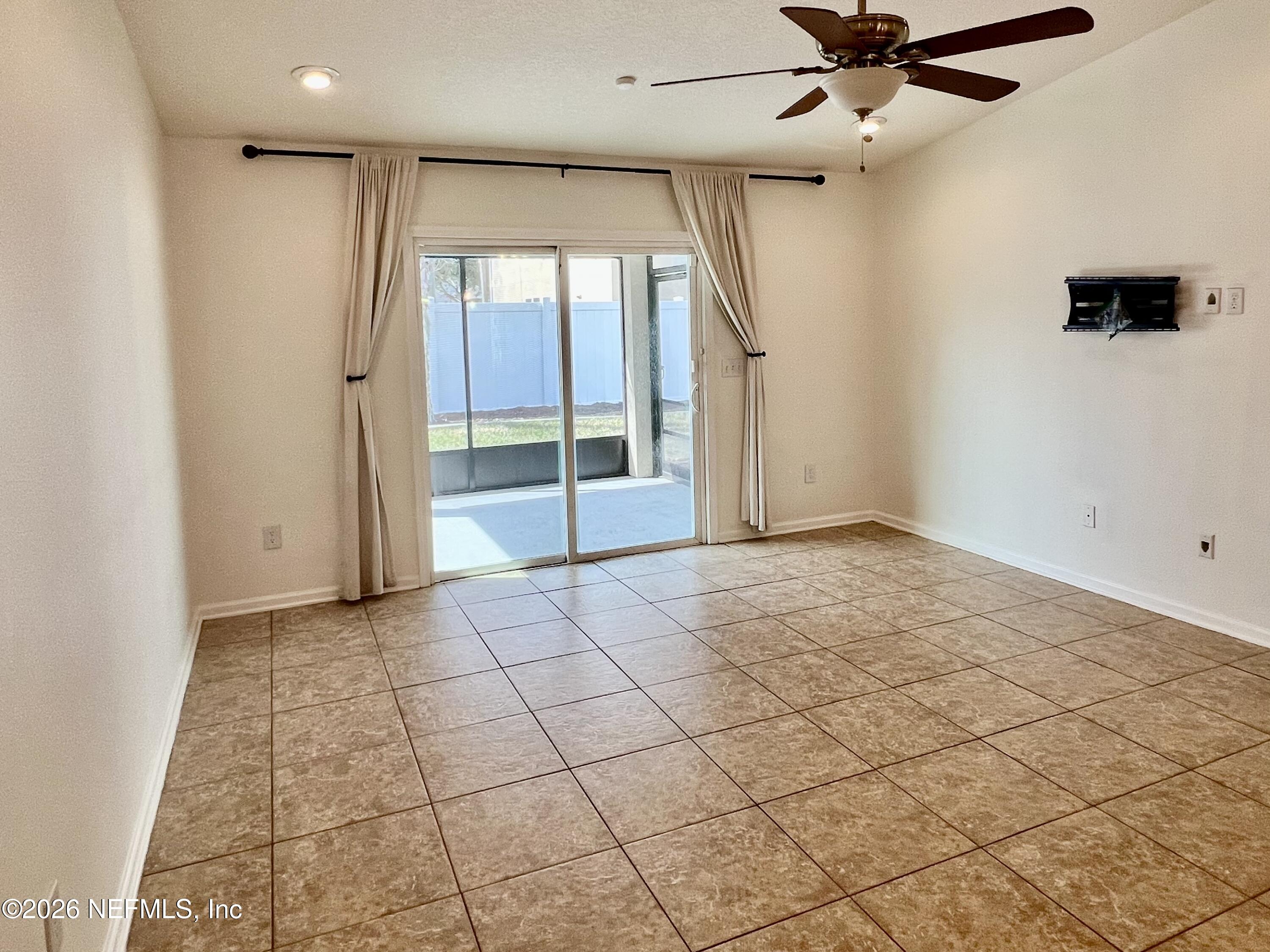 16264 Tisons Bluff Road Jacksonville, FL 32218 - Photo 13 of 36 an empty room with fan and windows