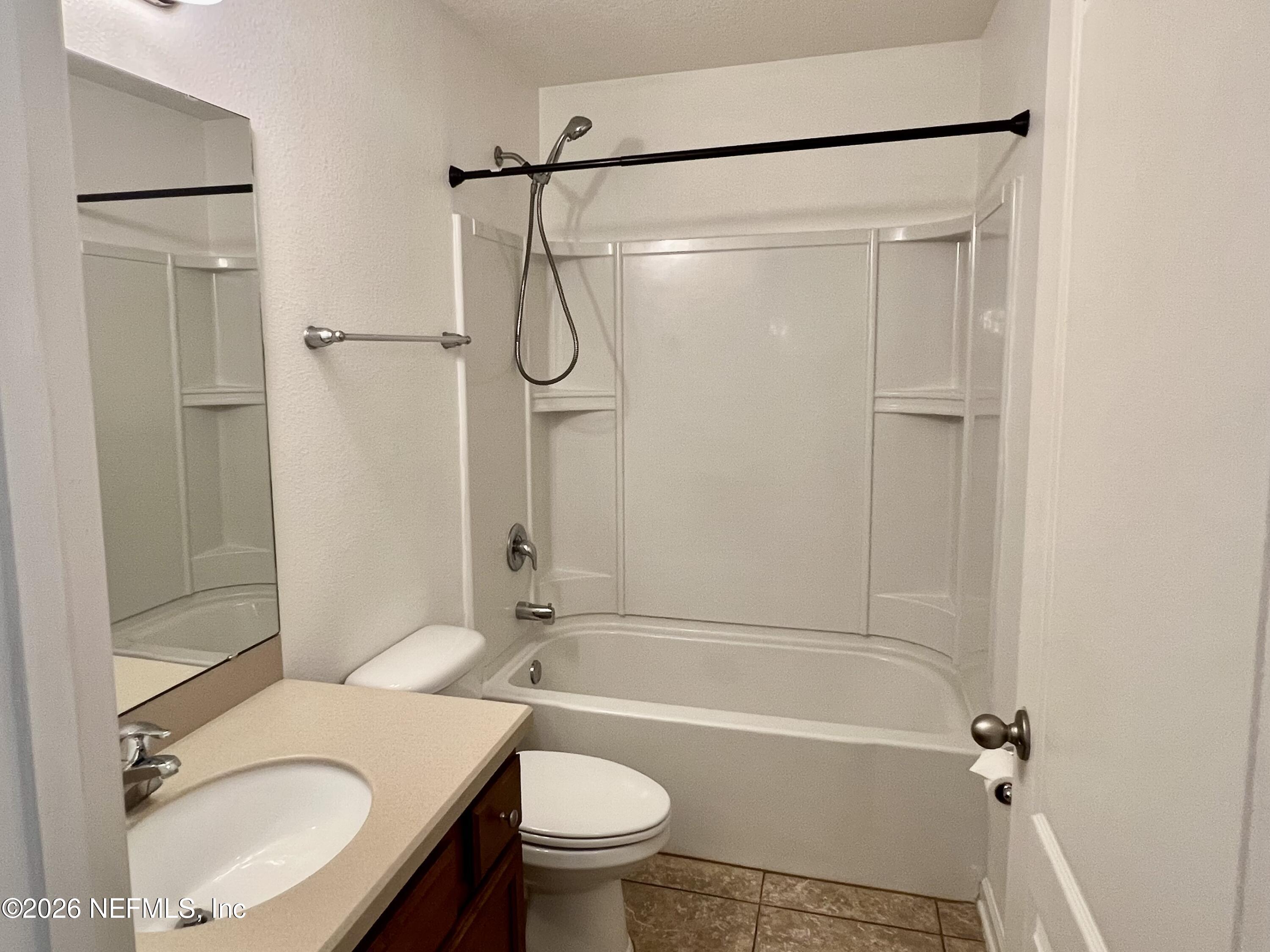 16264 Tisons Bluff Road Jacksonville, FL 32218 - Photo 14 of 36 a bathroom with a sink toilet and shower