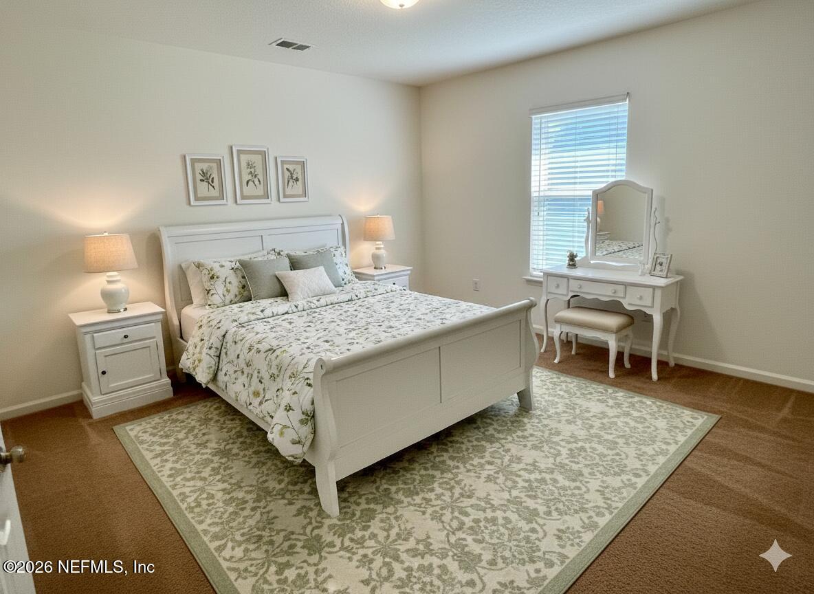 16264 Tisons Bluff Road Jacksonville, FL 32218 - Photo 20 of 36 a bedroom with a bed and a table in it