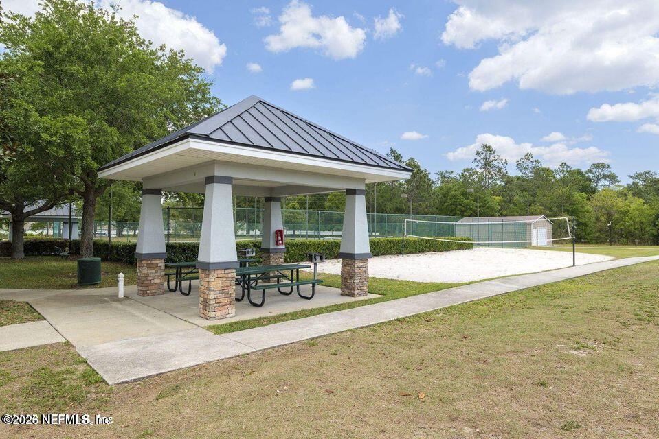 16264 Tisons Bluff Road Jacksonville, FL 32218 - Photo 33 of 36 a view of a house with sitting area and a yard