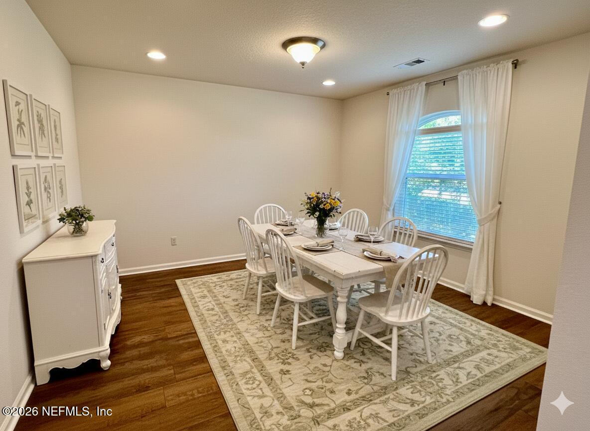 16264 Tisons Bluff Road Jacksonville, FL 32218 - Photo 6 of 36 a view of a dining room with furniture window and wooden floor