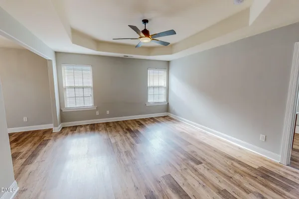 a view of empty room with ceiling fan