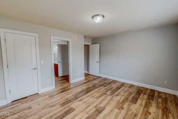a white toilet sitting next to a window