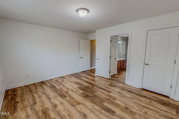a view of a hallway with closet