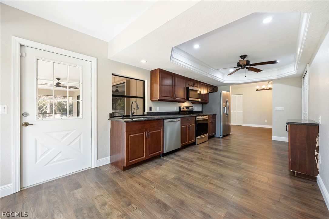 18890 Fox Run Road Alva, FL 33920 - Photo 12 of 50 a view of kitchen with sink and refrigerator