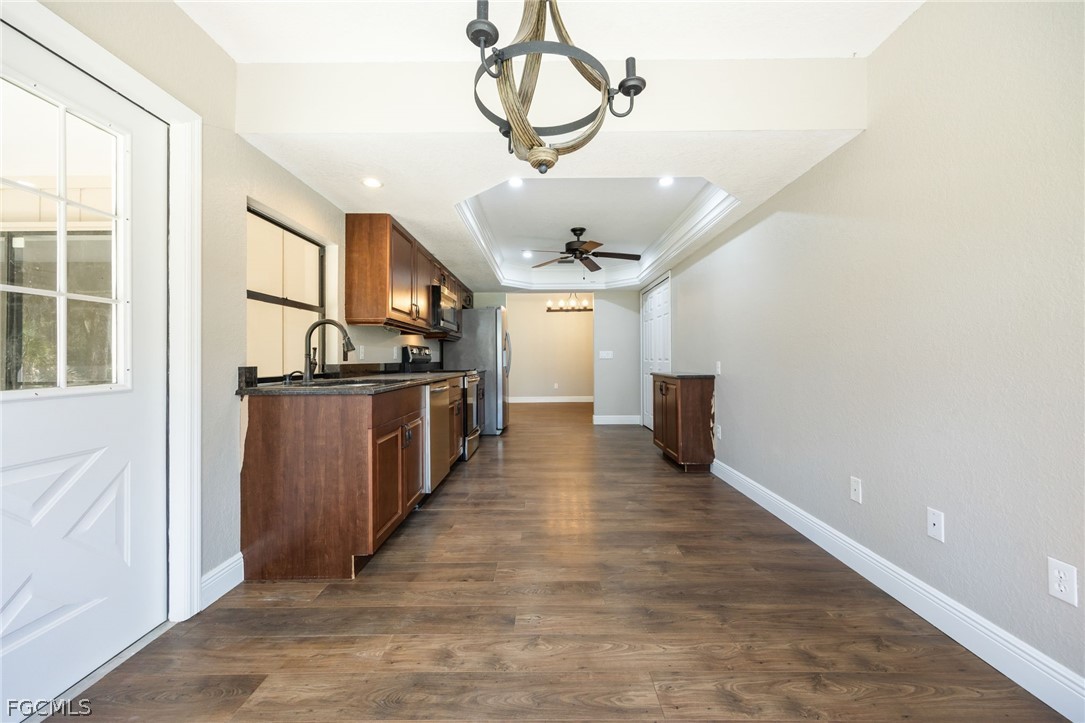 18890 Fox Run Road Alva, FL 33920 - Photo 13 of 50 a view of a kitchen with a sink and a refrigerator