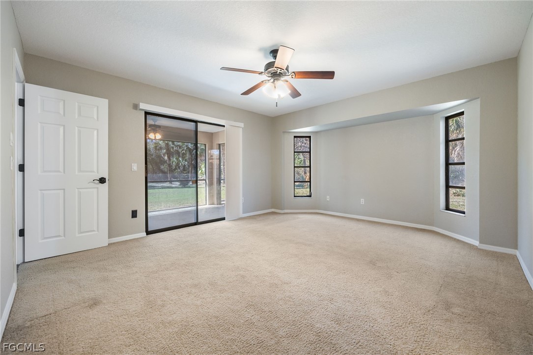 18890 Fox Run Road Alva, FL 33920 - Photo 16 of 50 a view of an empty room with chandelier fan