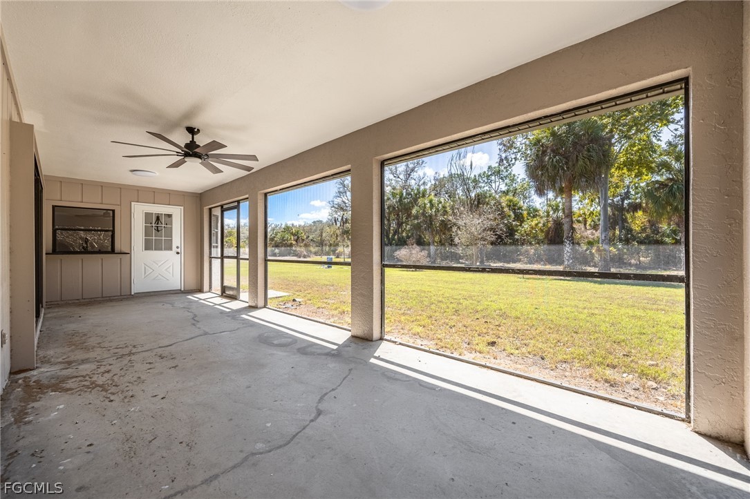 18890 Fox Run Road Alva, FL 33920 - Photo 28 of 50 a view of an empty room with a window and a flat screen tv