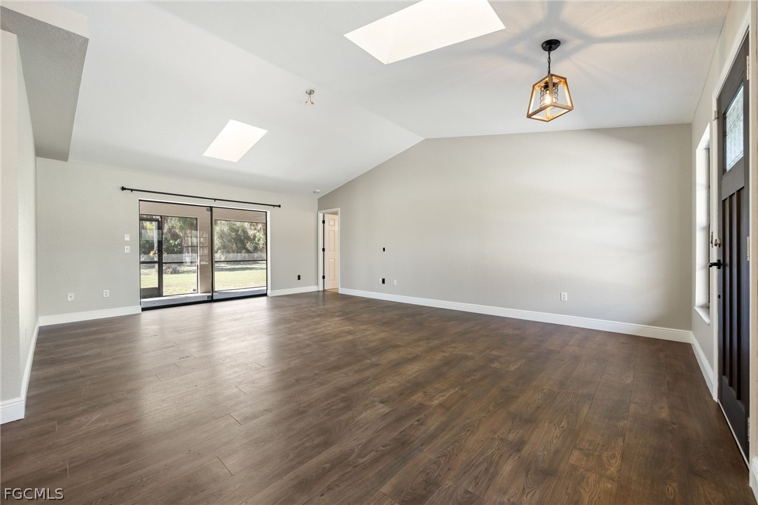 18890 Fox Run Road Alva, FL 33920 - Photo 4 of 50 wooden floor in an empty room with a window
