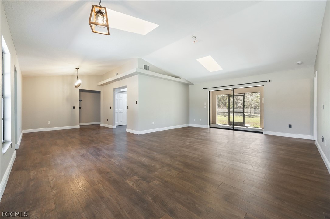18890 Fox Run Road Alva, FL 33920 - Photo 5 of 50 an empty room with wooden floor and windows