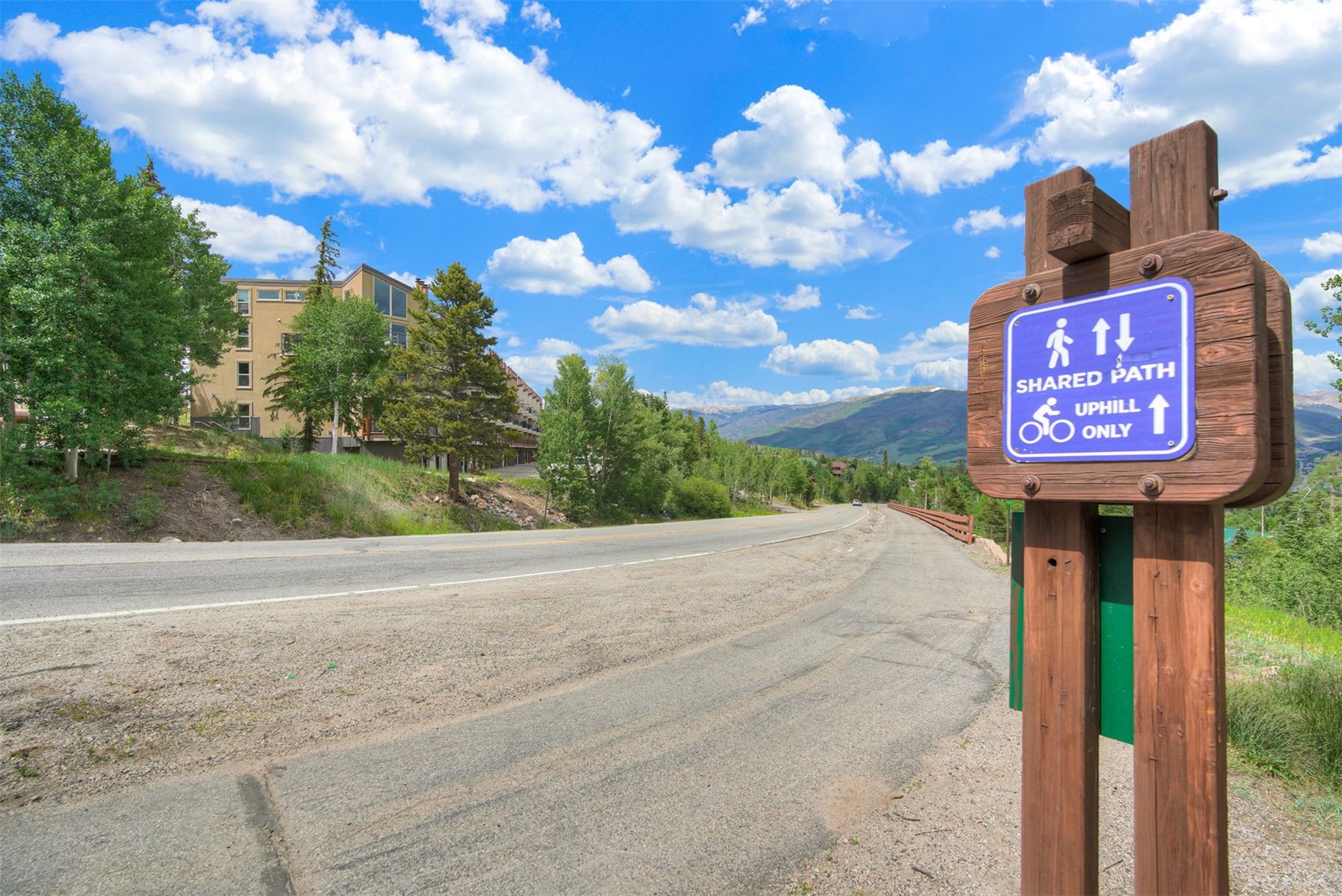 7031 Ryan Gulch Road, Unit 301 Silverthorne, CO 80498 - Photo 27 of 37 a street sign on a sidewalk next to a road