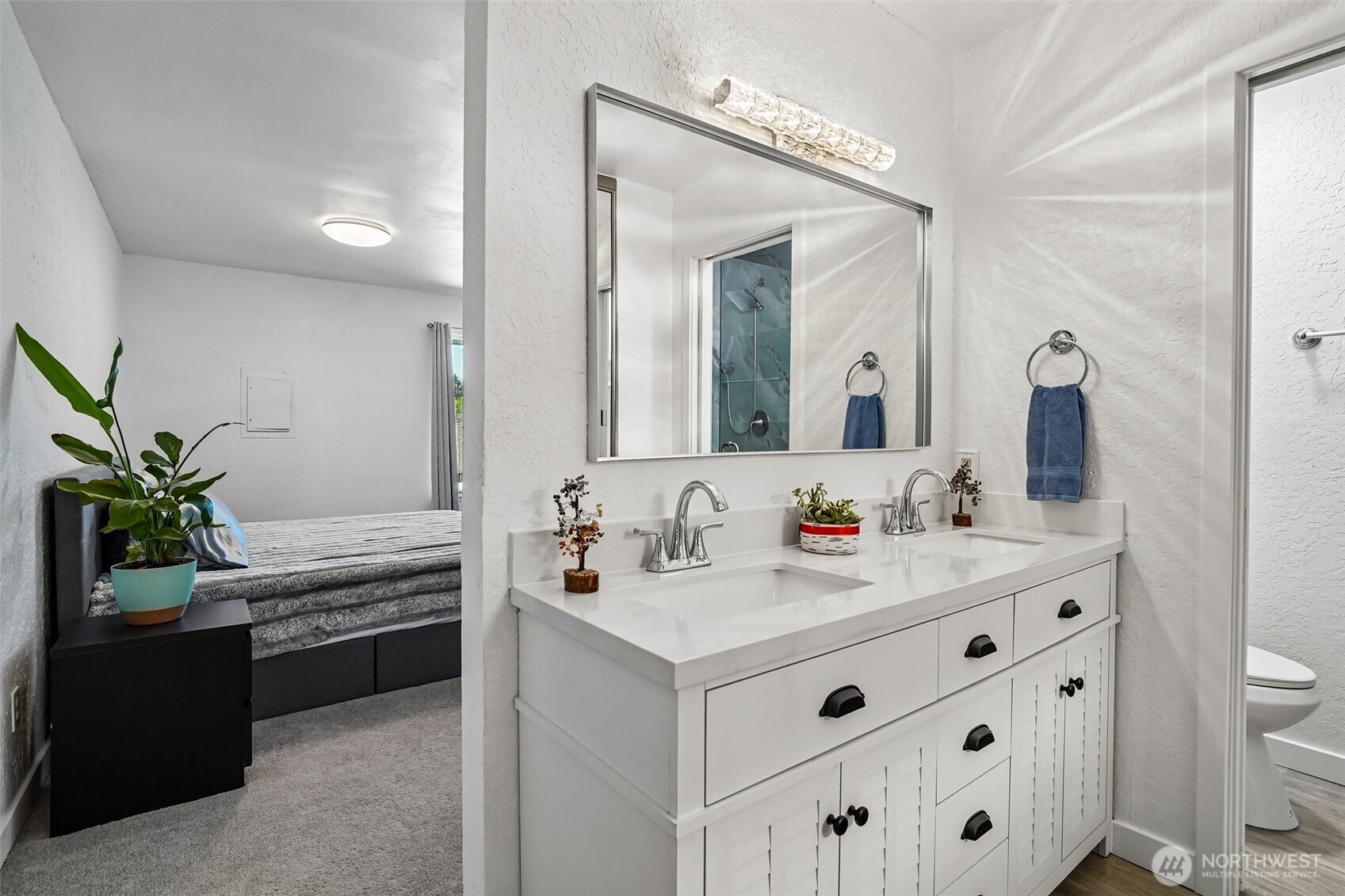 14401 Southeast Petrovitsky Road, Unit D205 Renton, WA 98058 - Photo 14 of 32 a bathroom with a sink and a mirror