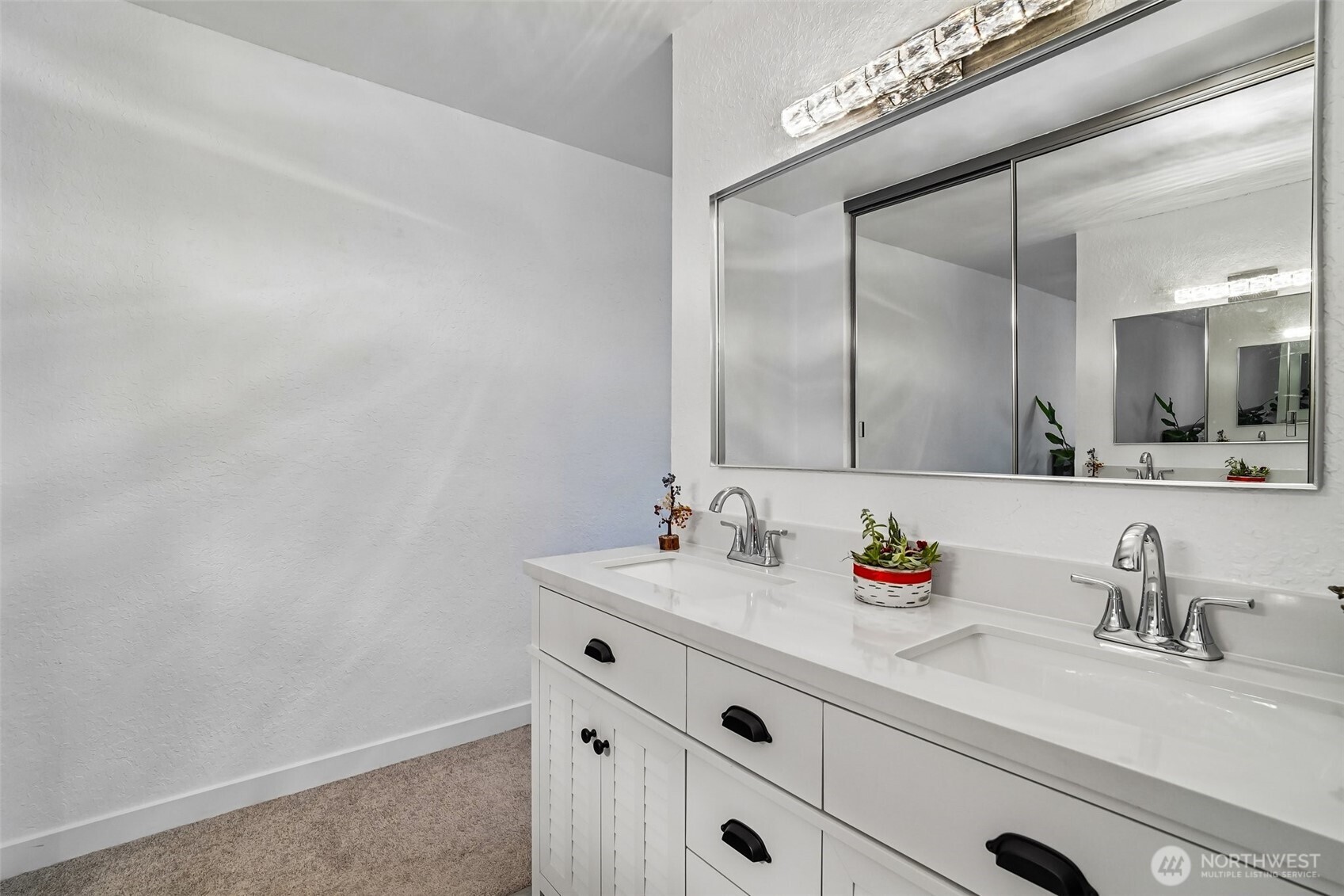14401 Southeast Petrovitsky Road, Unit D205 Renton, WA 98058 - Photo 17 of 32 a bathroom with a sink and a mirror