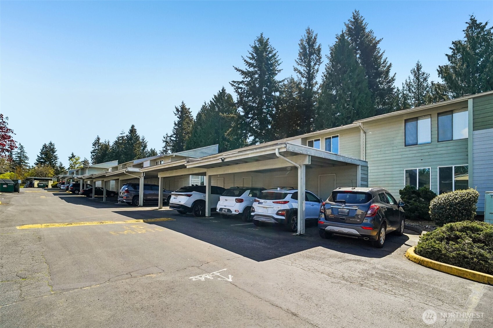 14401 Southeast Petrovitsky Road, Unit D205 Renton, WA 98058 - Photo 2 of 32 a view of a car parked in front of a house