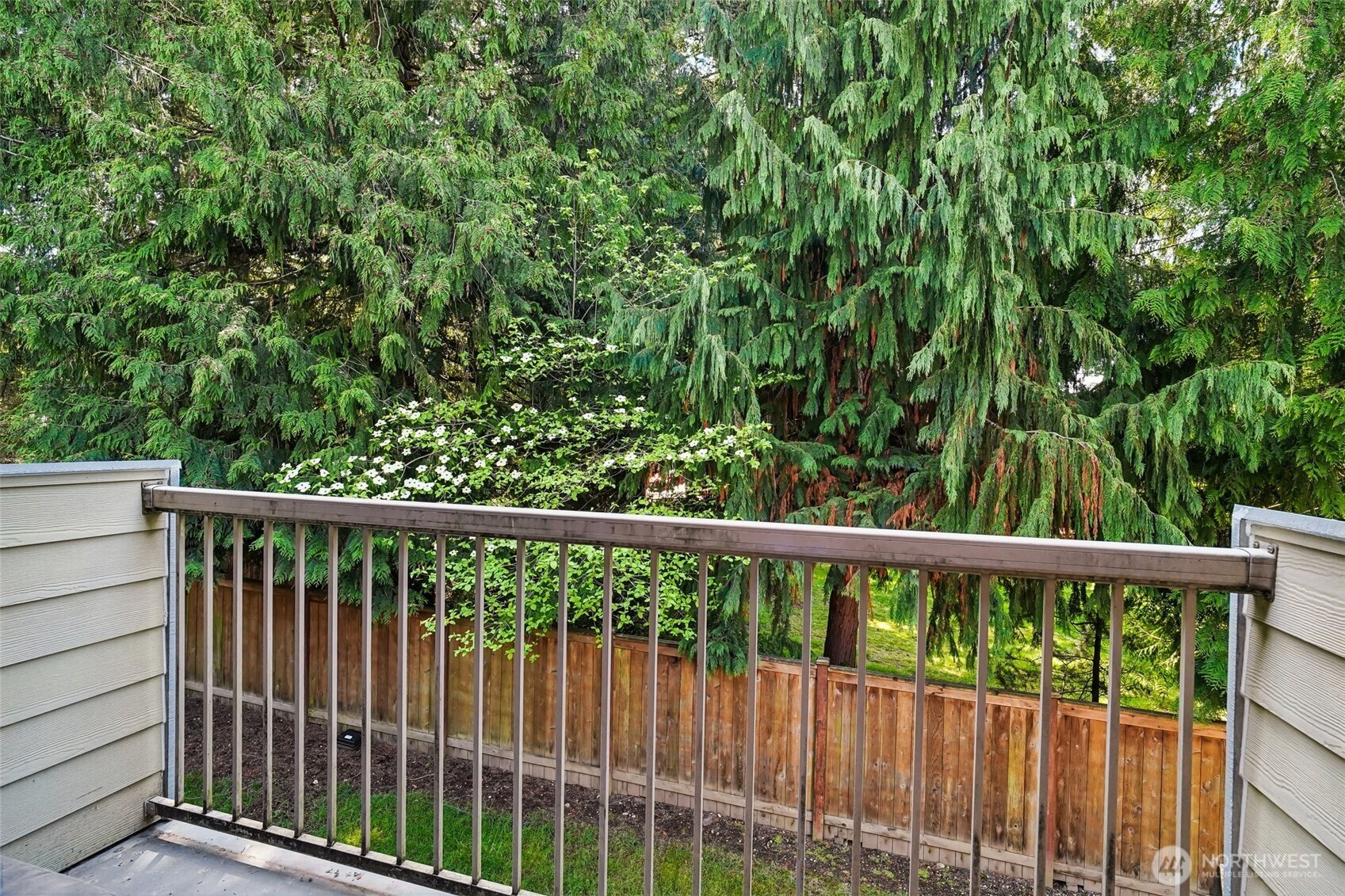 14401 Southeast Petrovitsky Road, Unit D205 Renton, WA 98058 - Photo 25 of 32 a view of a wooden fence